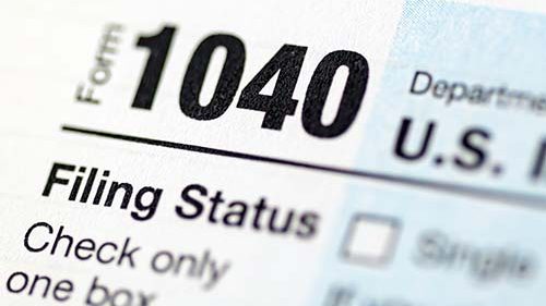 Image of Federal income tax form 1040. Free tax help is available at the libraries this tax season.