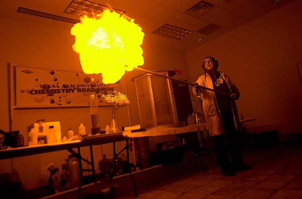 A chemistry student creates a fire tornado from a giant ball of flame at the Texas A&M University Chemistry Road Show.