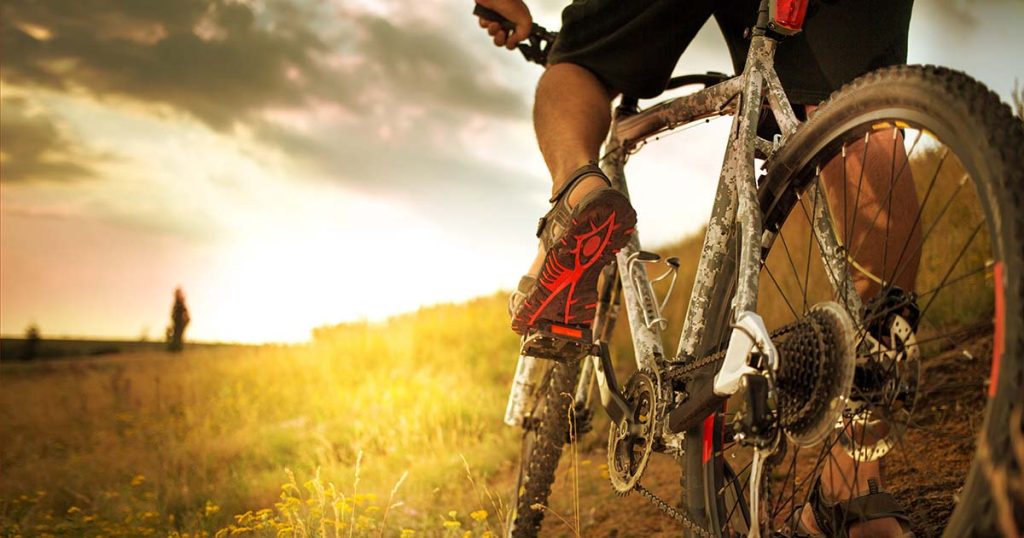 Outdoor cross-country bicycling at sunset.