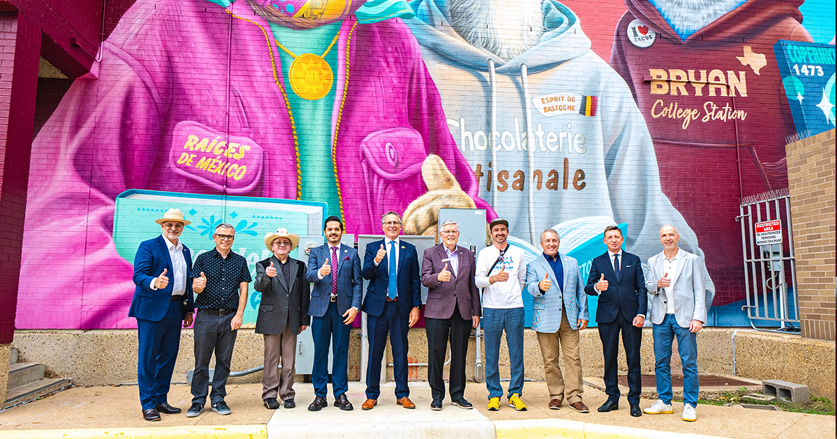 sponsors, councilmembers, and mural artist group photo in front of the new mural