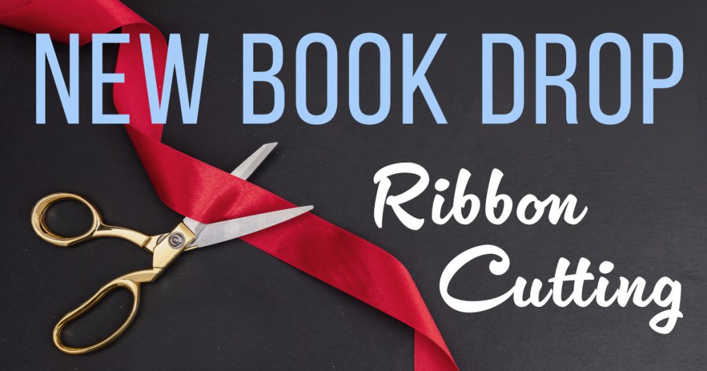 New book drop ribbon cutting